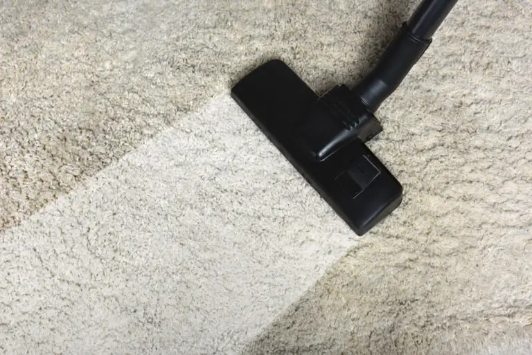 Healthy Home Carpet Maintenance: Research Shows What Cleaning Strategies Actually Work 2 Close-up view of a white carpet being cleaned with a professional carpet cleaning wand, clearly showing the contrast between the soiled and freshly cleaned sections, highlighting the effectiveness of deep steam cleaning.